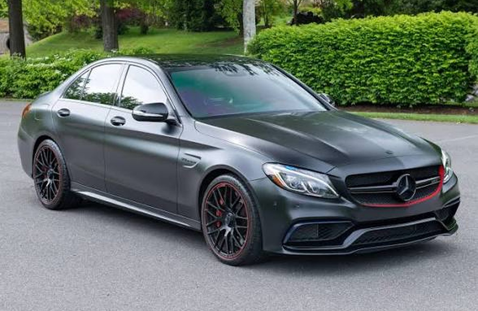 Detailed luxury sedan parked after exterior service